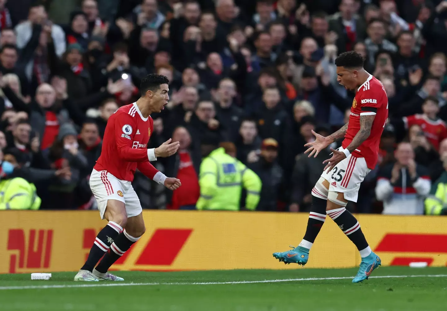 Cristiano Ronaldo and Jadon Sancho. (Alamy)