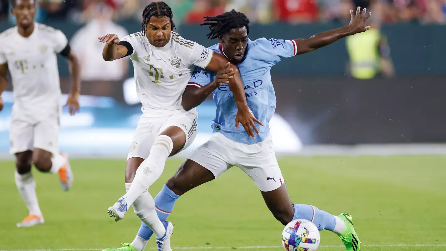 Manchester City defender Josh Wilson-Esbrand (97) battles for the ball against Bayern Munich midfielder Serge Gnabry.