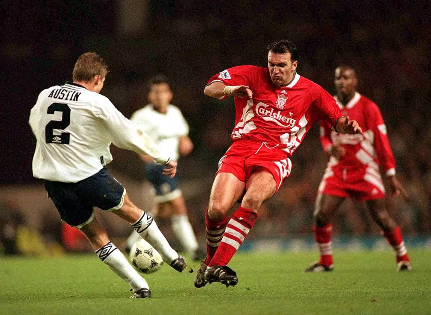 Neil Ruddock tackles Dean Austin during a match between Liverpool and Tottenham in 1994 (Image: Getty)