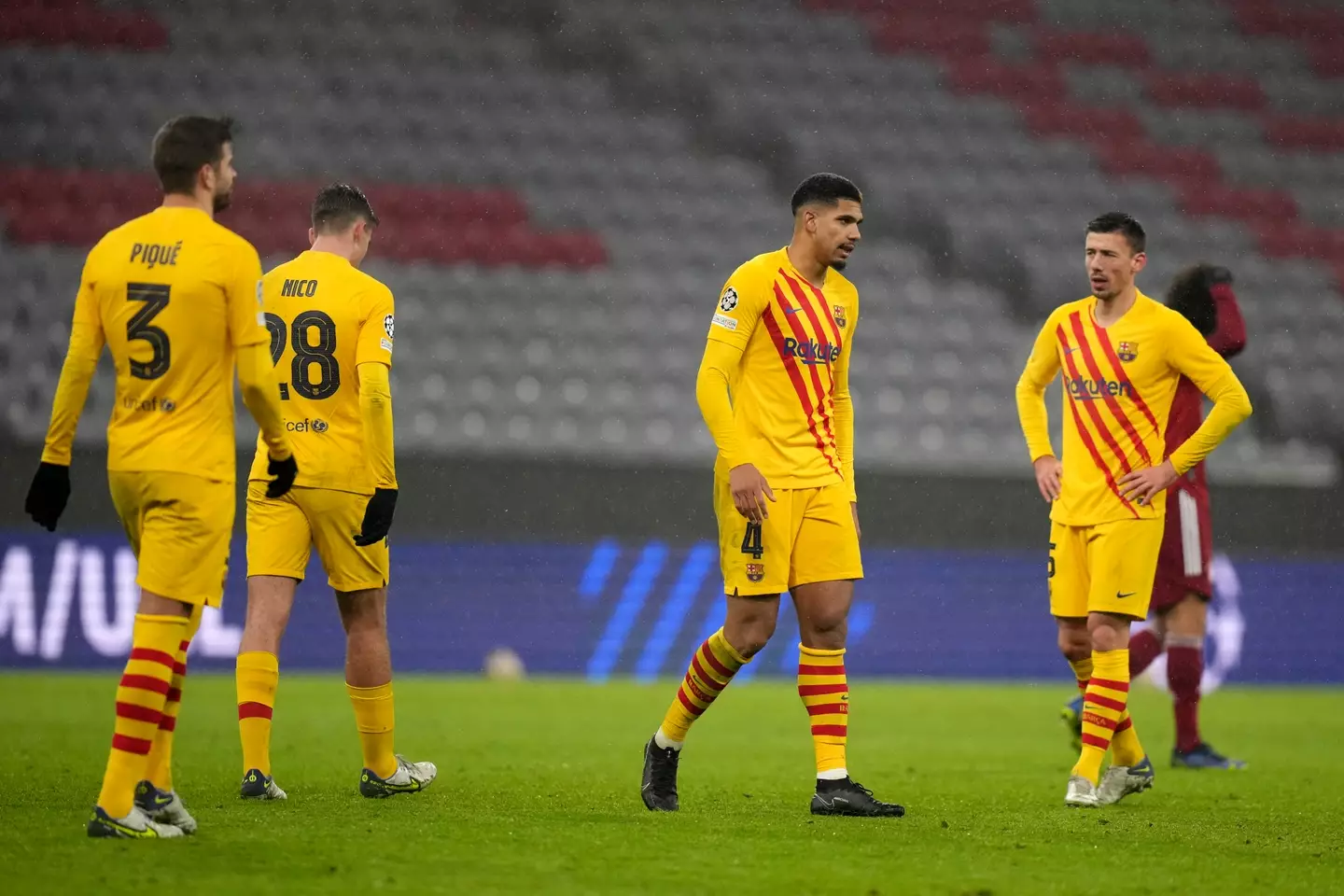 Barcelona players look downcast after the match. Image: PA Images