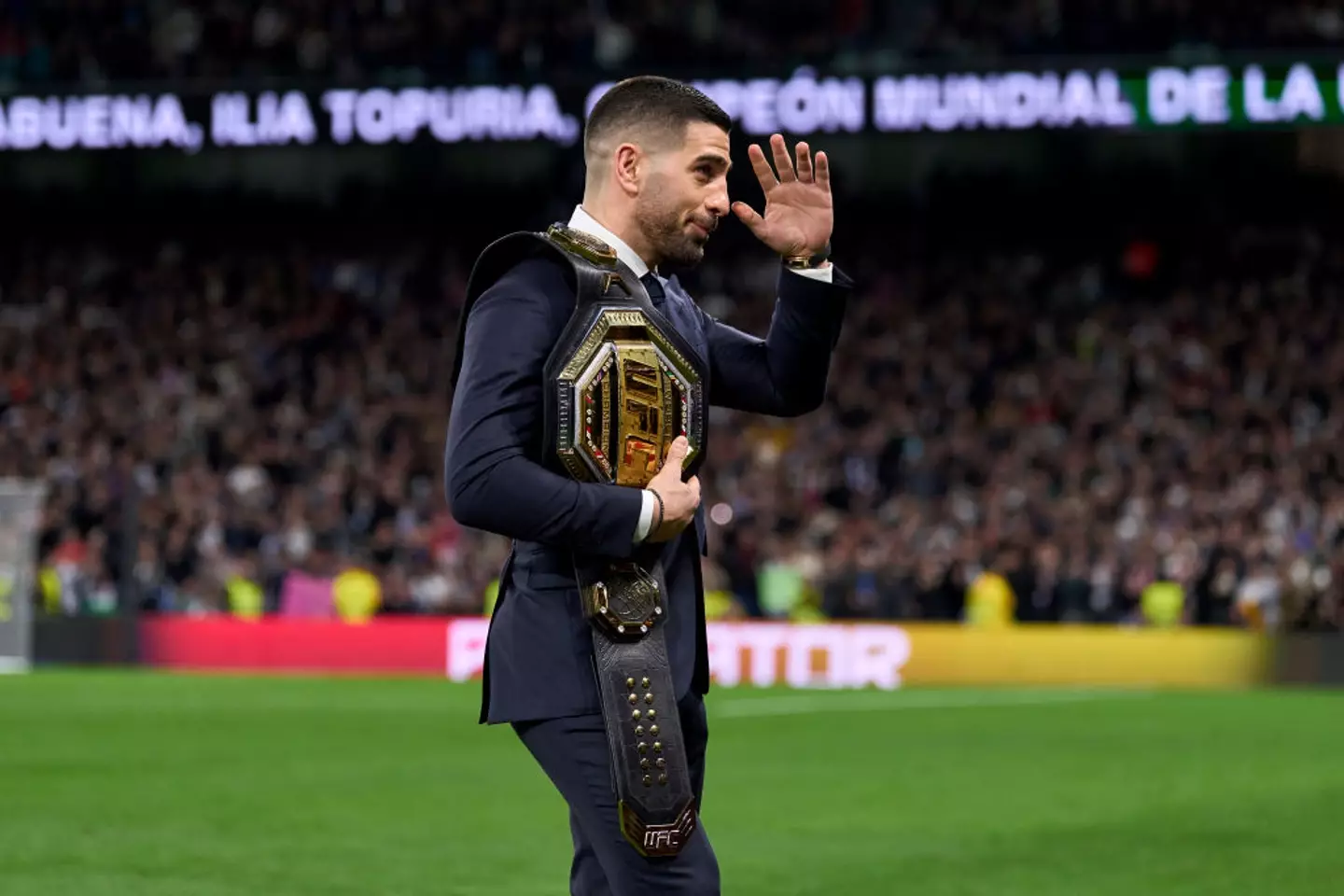 Spanish featherweight champion Ilia Topuria showed off his UFC belt to Real Madrid fans at the Bernabeu after beating Alexander Volkanovski earlier this year. (Image: Getty)