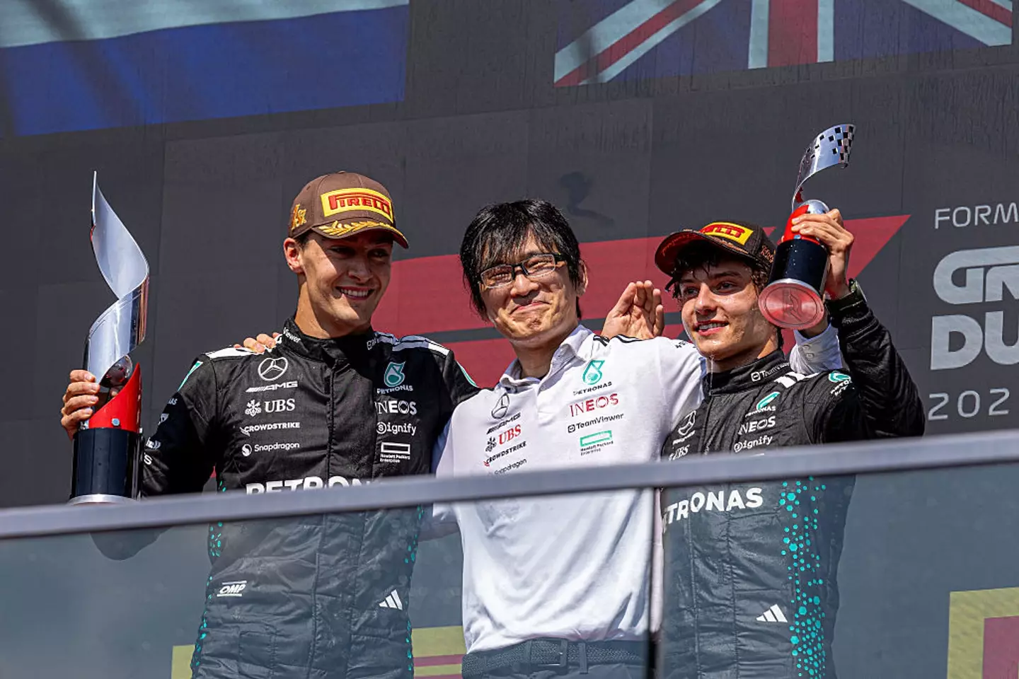 George Russell pictured alongside team-mate Kimi Antonelli (right) after they finished in first and third in the Canadian GP (Image: Getty)