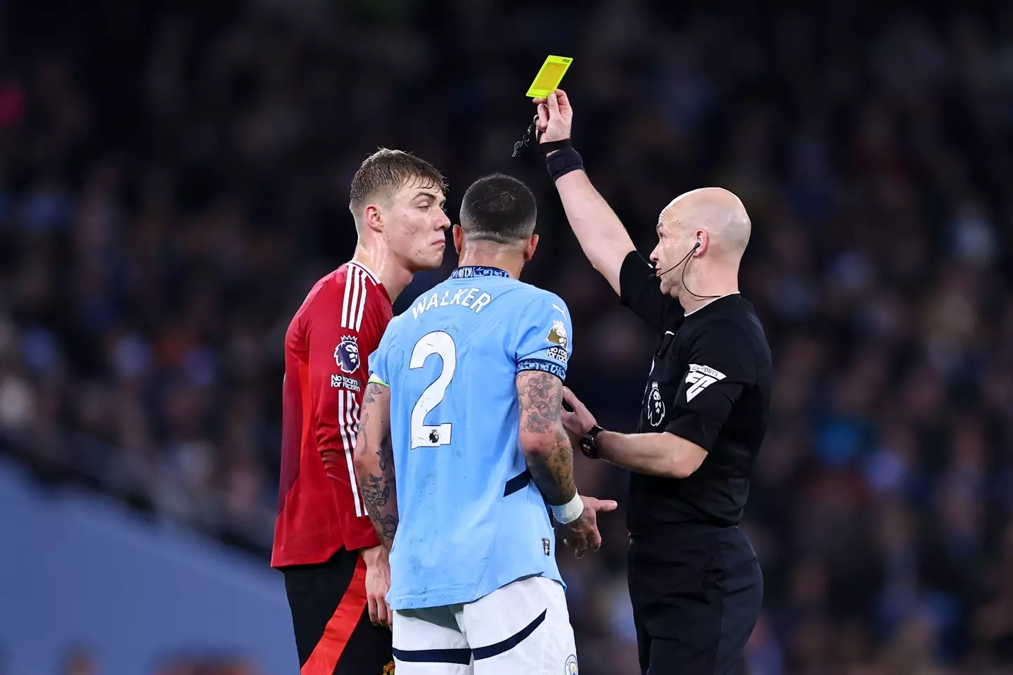 Both Kyle Walker and Rasmus Hojlund were cautioned after clashing. Image: Getty