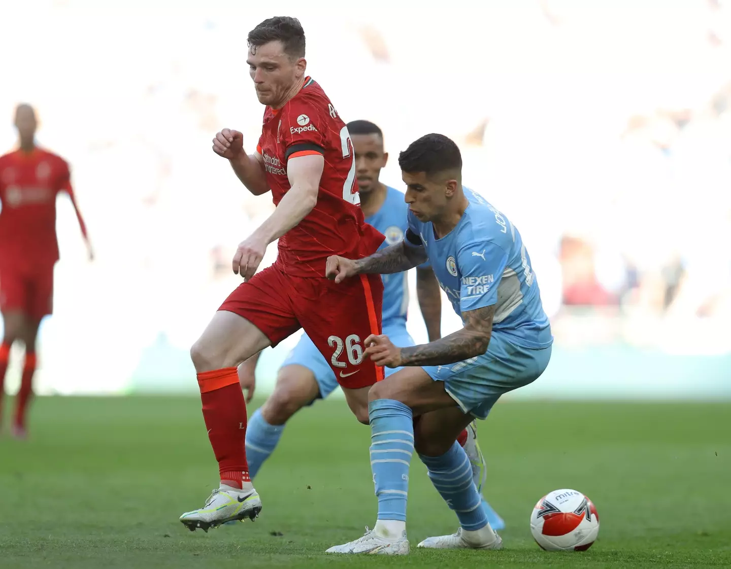 Andy Robertson and Joao Cancelo fight for the ball during the FA Cup semi-final last season |