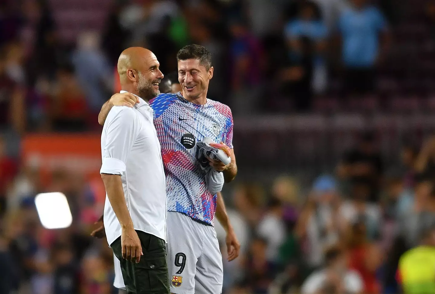 Guardiola and Robert Lewandowski catch up. Image: Alamy