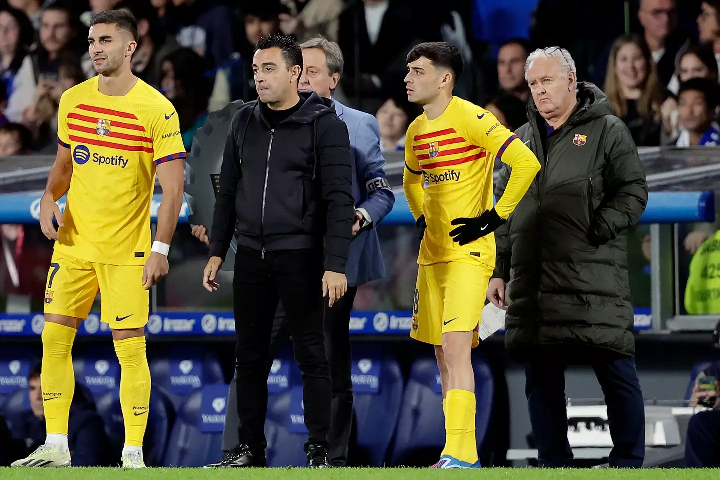 Torres alongside Barcelona manager Xavi. (Image