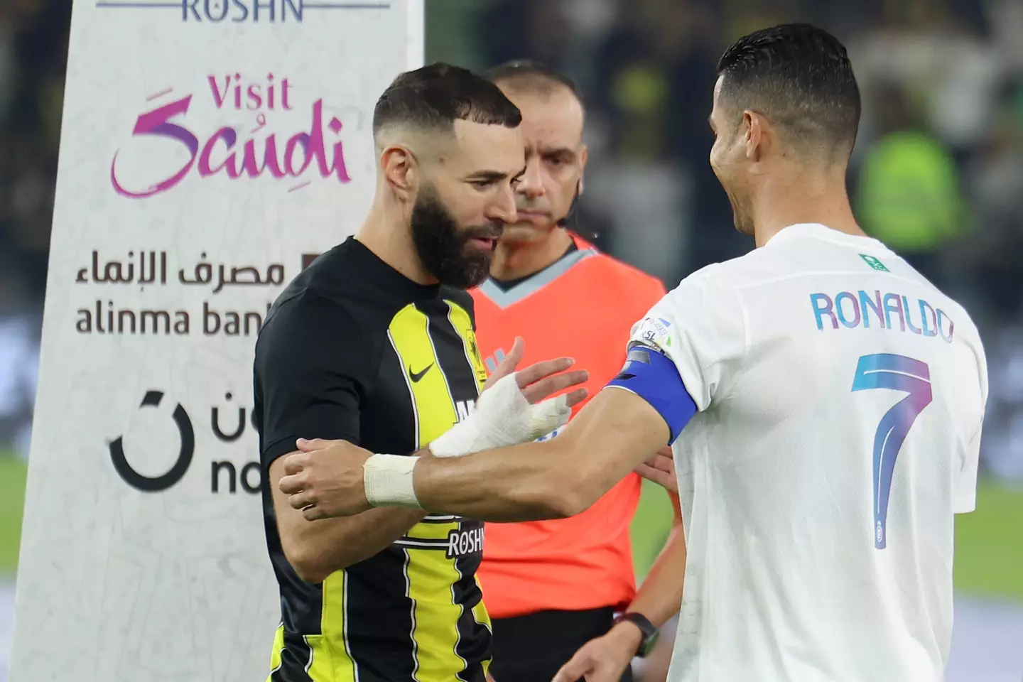 Benzema and Ronaldo embrace during Al Ittihad's clash with Al Nassr. (Image