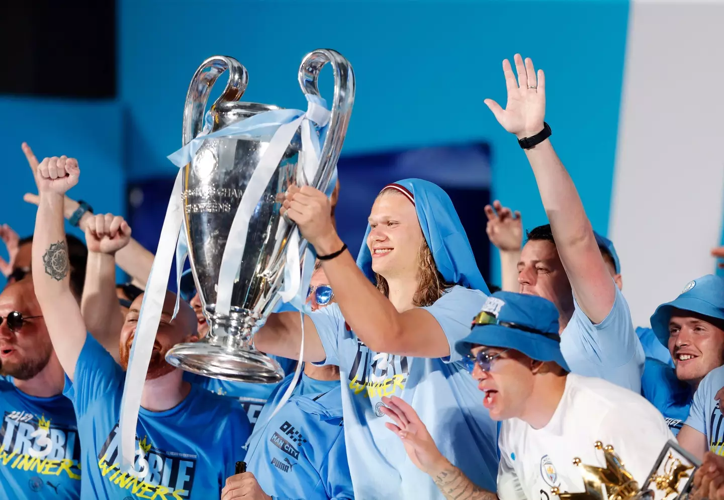 Erling Haaland holds aloft the Champions League trophy. Image: Alamy