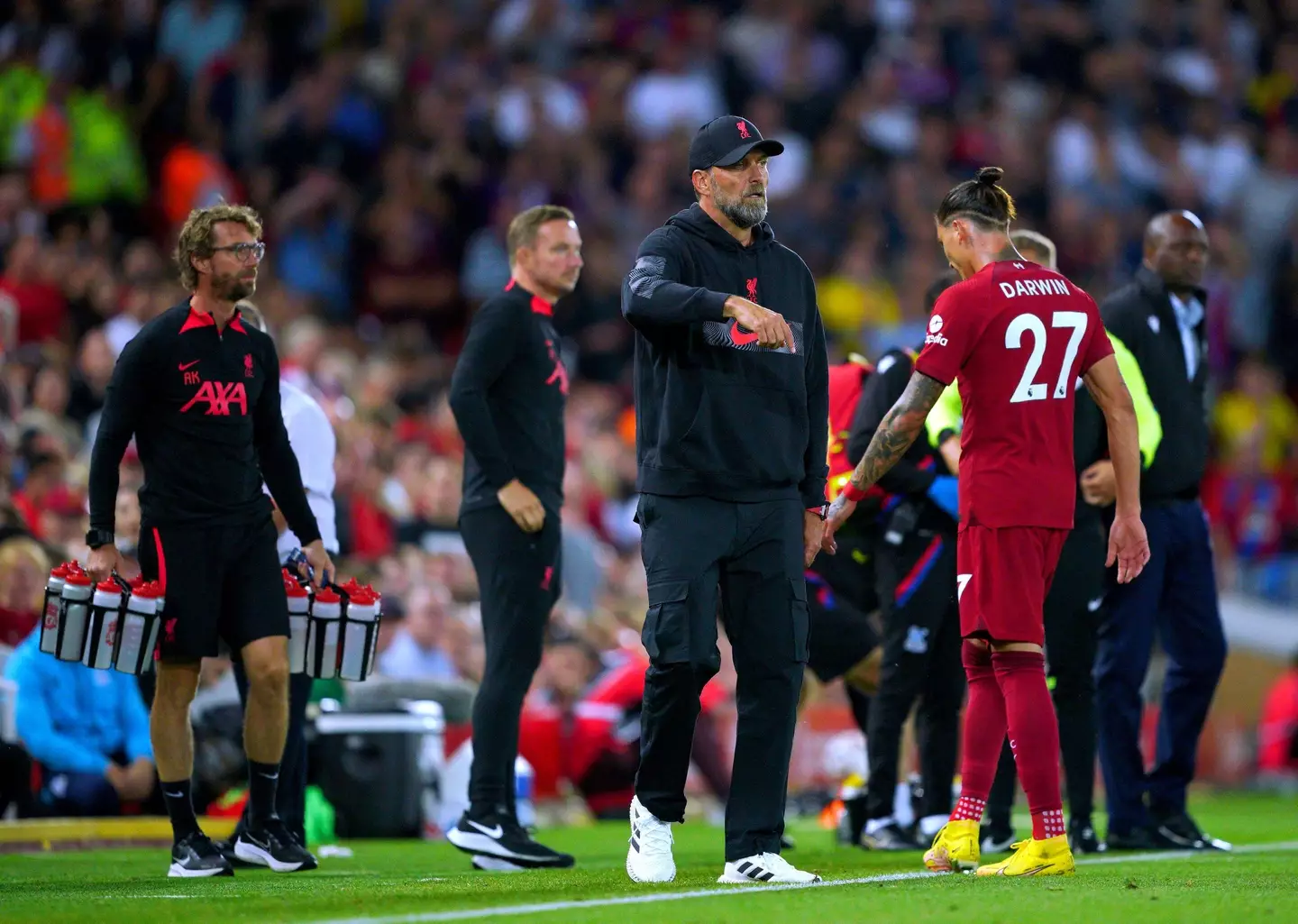 Nunez walks past Liverpool manager Jurgen Klopp after being dismissed. (Image