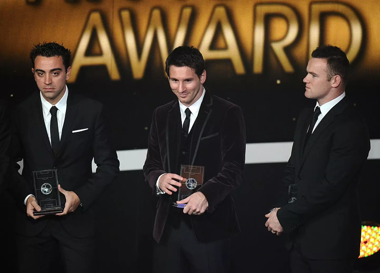 Xavi, Lionel Messi and Wayne Rooney (Credit:Getty)
