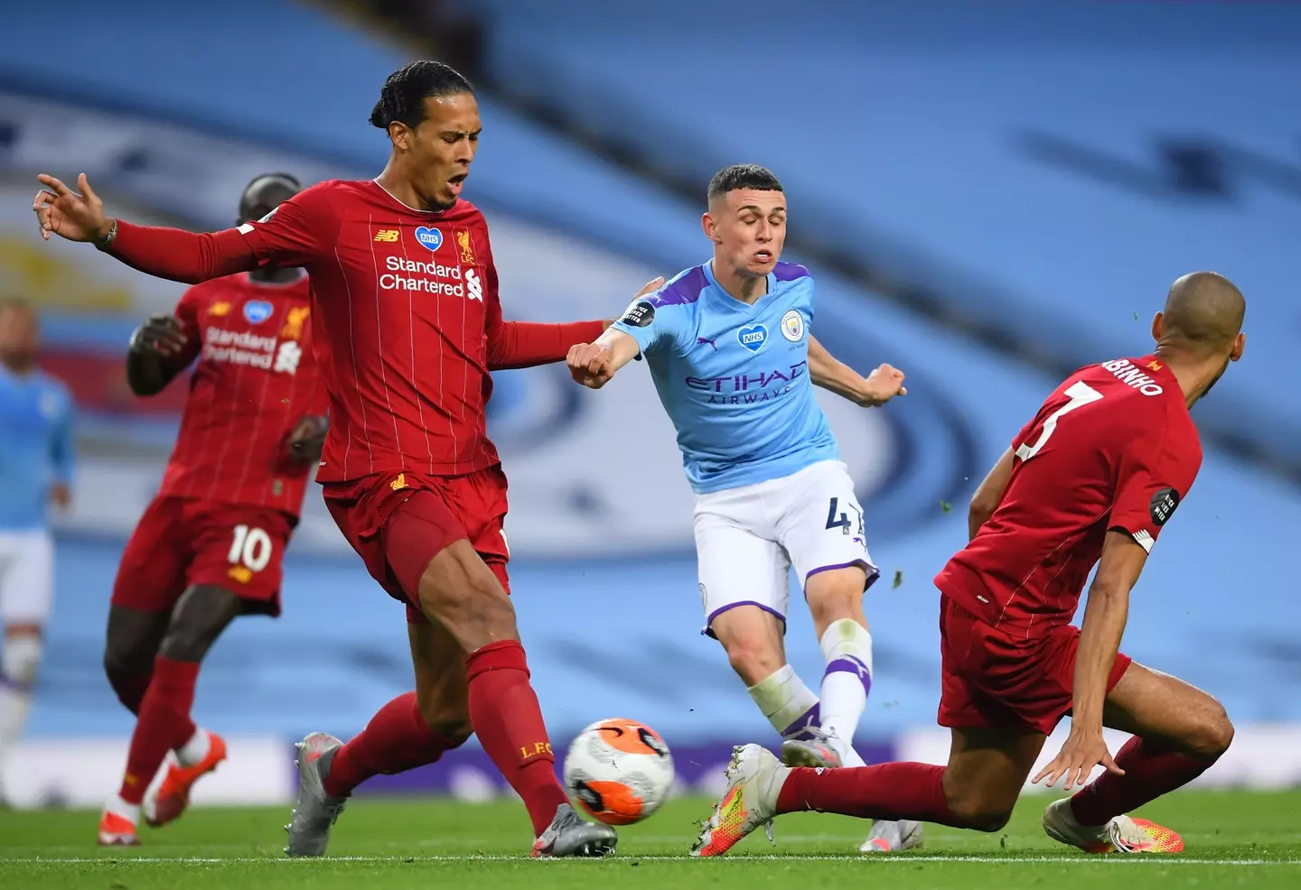 Phil Foden and Virgil van Dijk during Manchester City vs. Liverpool. Image: Getty 