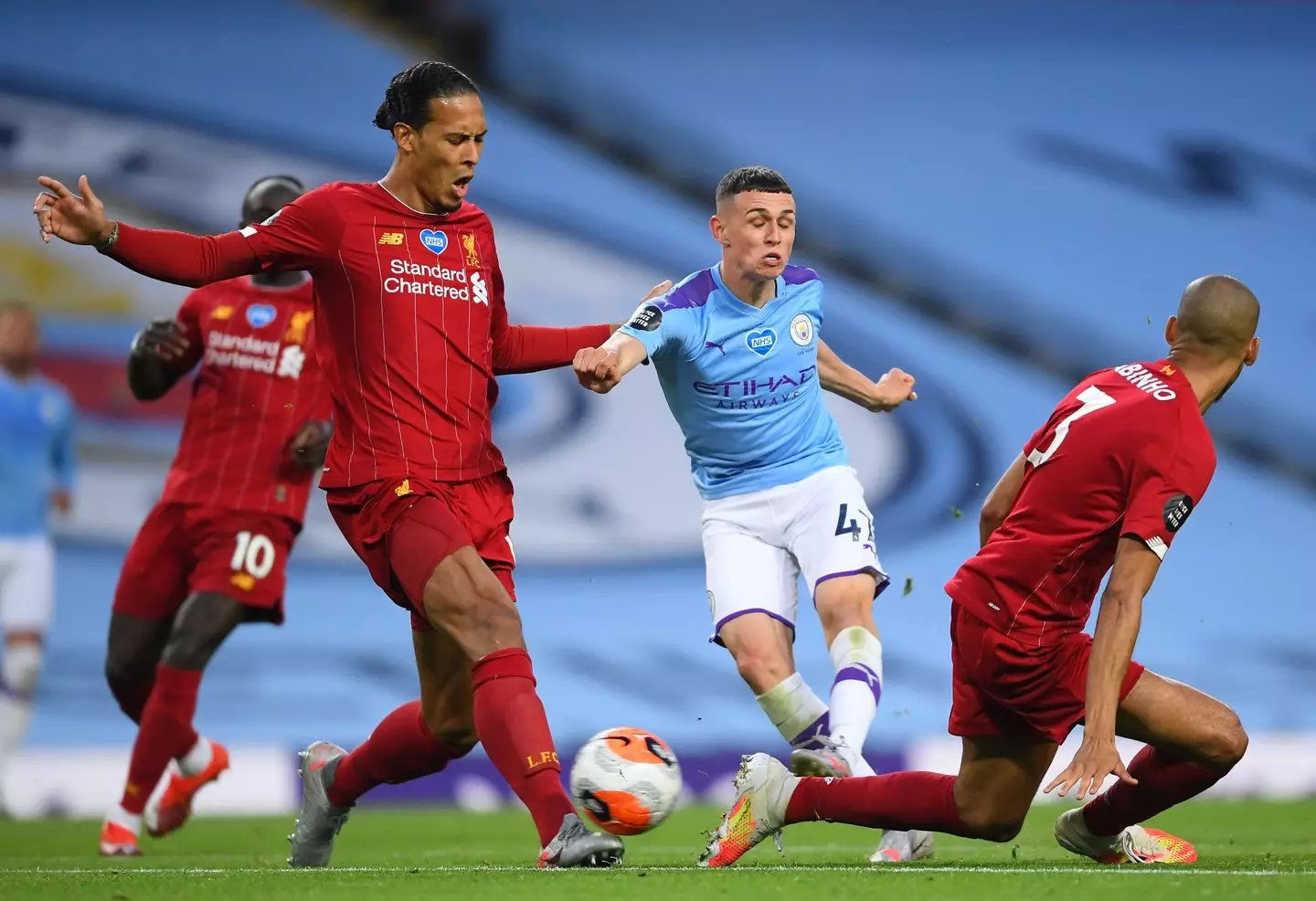 Phil Foden and Virgil van Dijk during Manchester City vs. Liverpool. Image: Getty