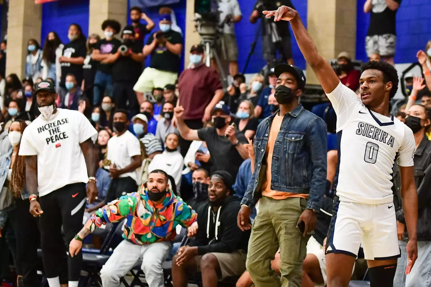 LeBron and Drake watching Bronny play.