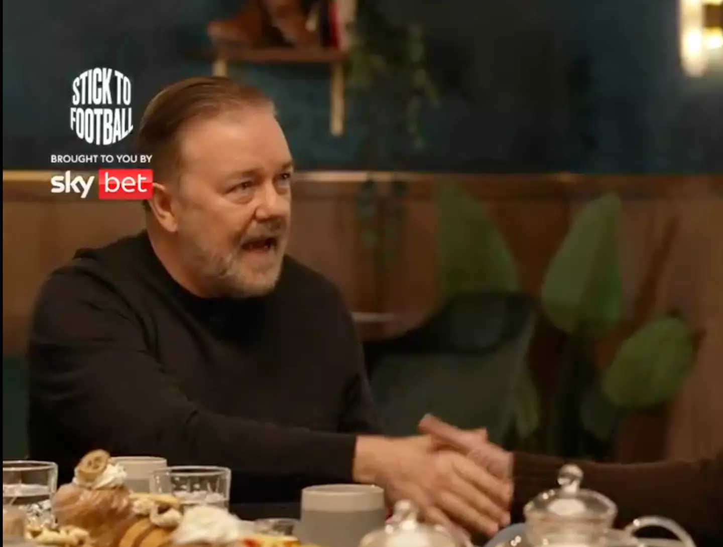 Gervais shakes Keane's hand. Image credit: The Overlap