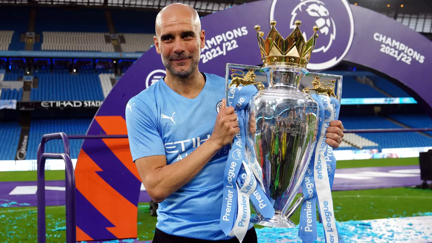 Pep Guardiola with the Premier League trophy