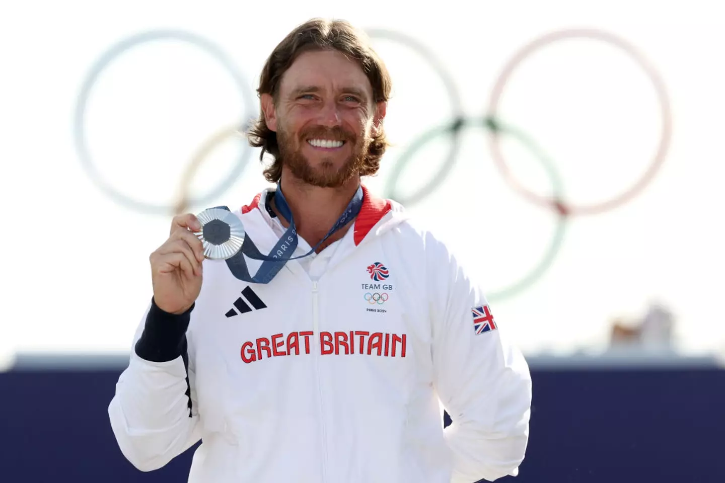Tommy Fleetwood finished second in the men's golf event at Paris 2024, claiming the silver medal while the USA's Scottie Scheffler won gold. (Image: Getty)
