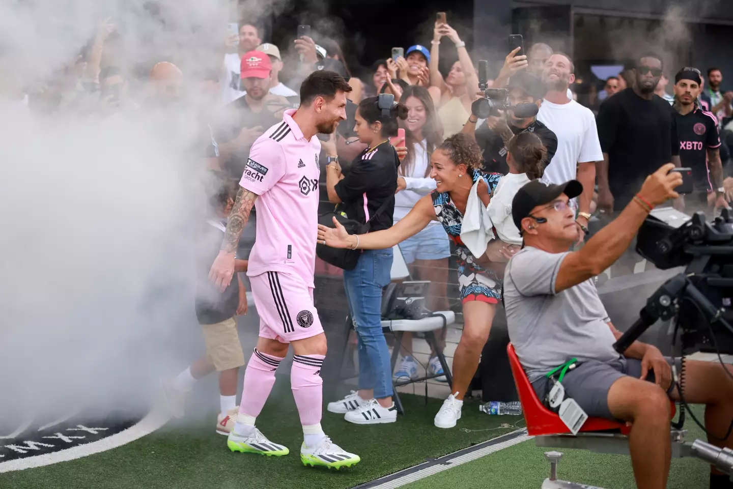 Lionel Messi walks out with DJ Khaled's son. Image: Getty