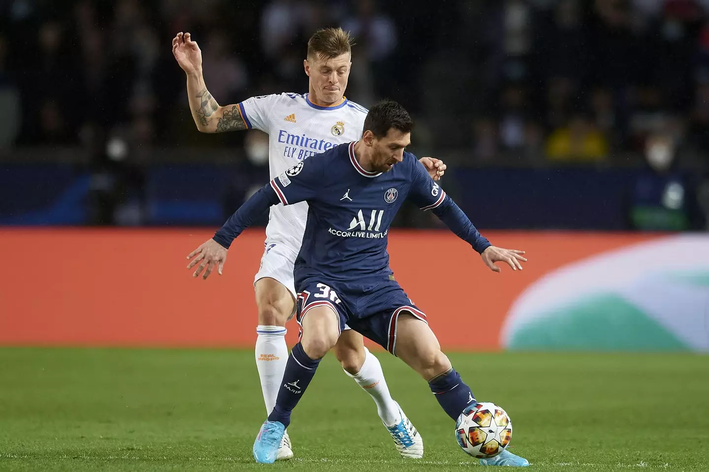 Kroos attempts to dispossess Messi during Real Madrid's Champions League game with Paris Saint-Germain last season. (Image