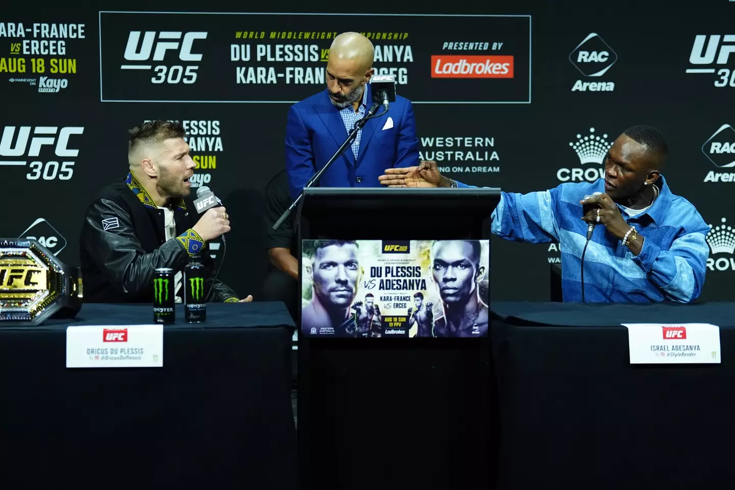 Dricus du Plessis and Israel Adesanya exchange words at the UFC 305 pre-fight presser. Image: Getty