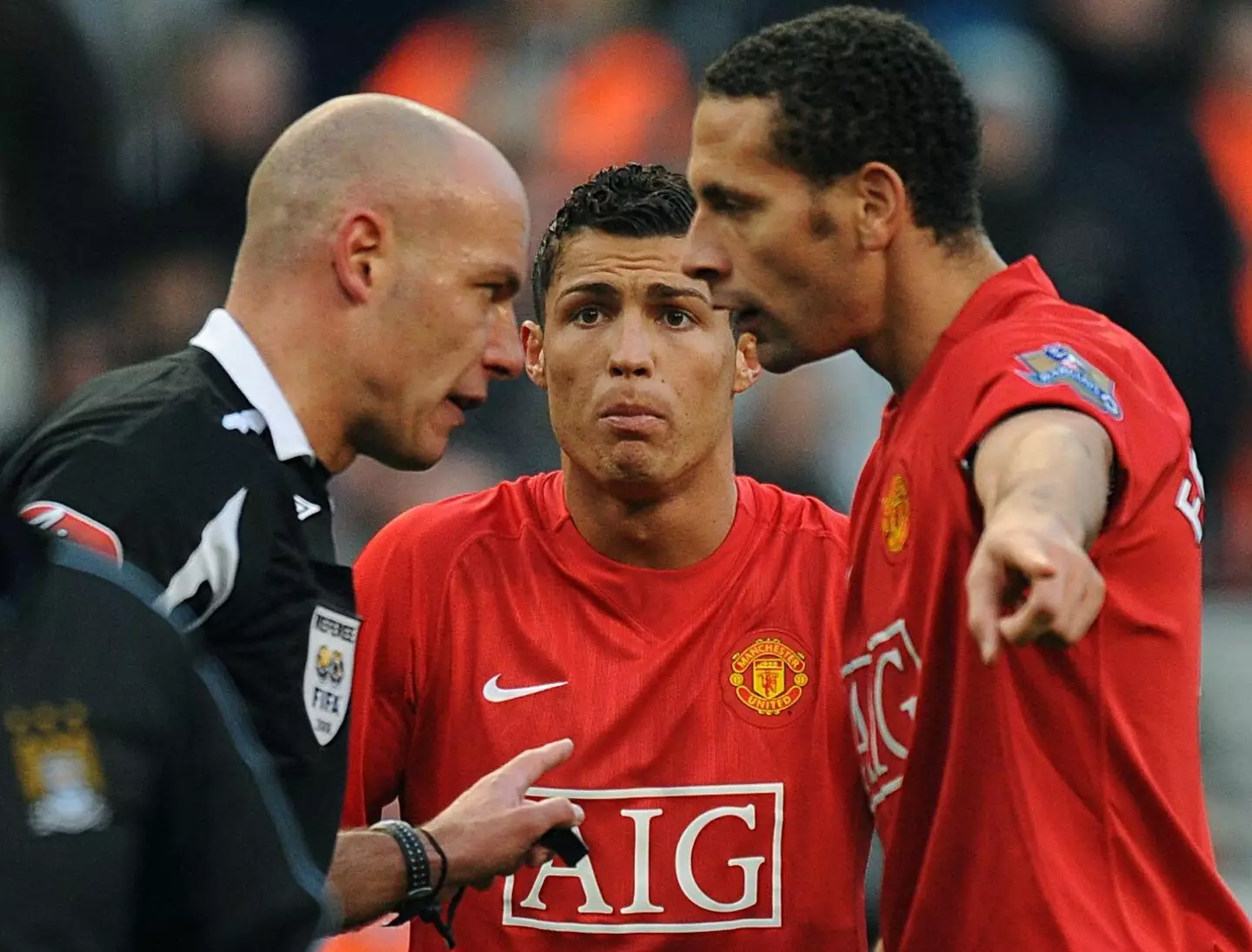 Manchester United's Cristiano Ronaldo and Rio Ferdinand argue with Howard Webb after Webb shows Ronaldo a red card. (Alamy)