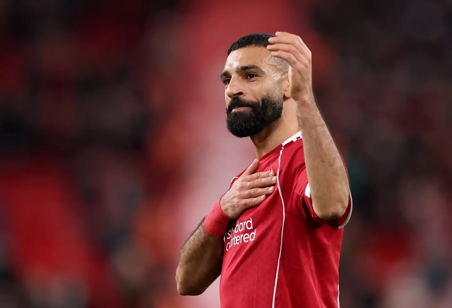 Salah acknowledges the Liverpool fans following Saturday's win over Brighton. Image credit: Getty