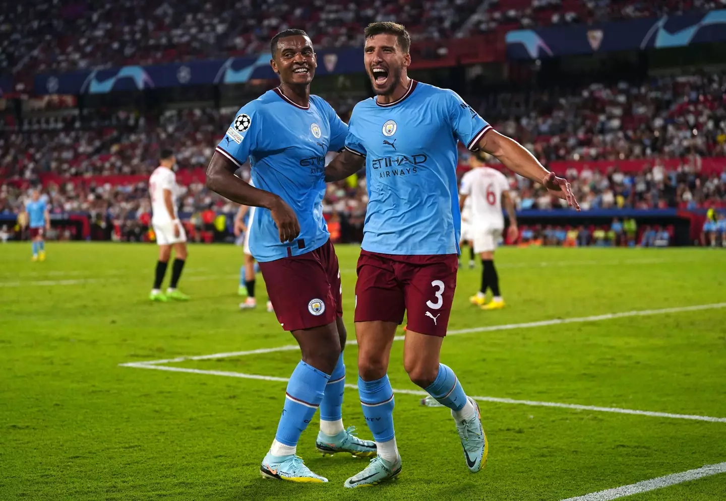 Ruben Dias celebrates with Manuel Akanji after scoring against Sevilla in the Champions League (PA Images/Alamy)