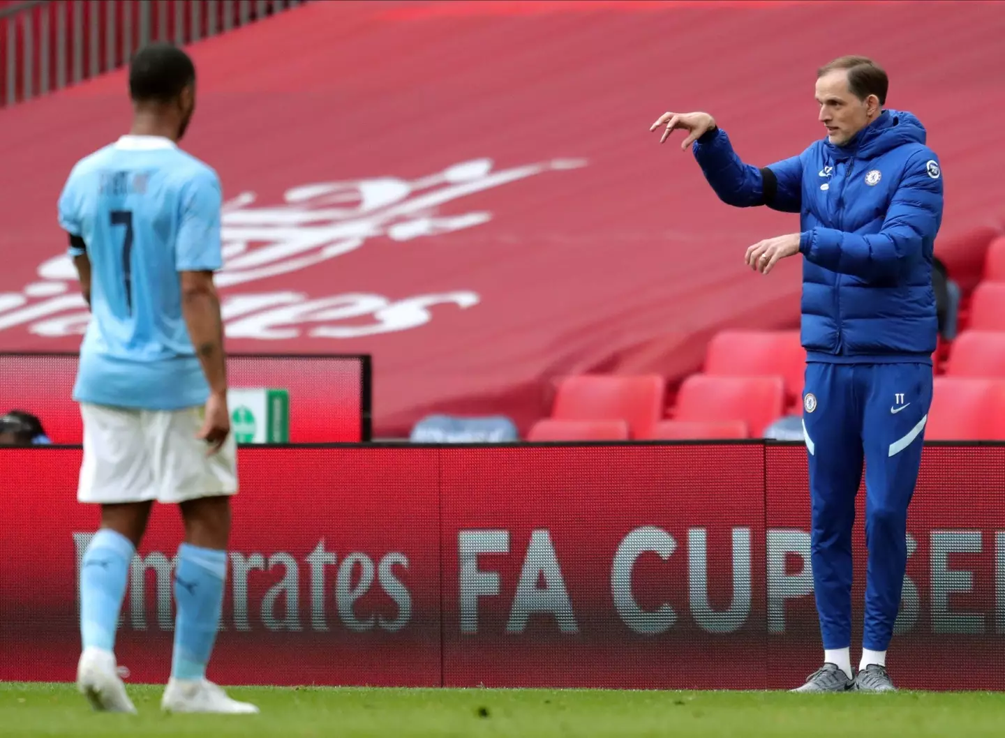 Thomas Tuchel delivers instructions as Raheem Sterling looks on. (Alamy)