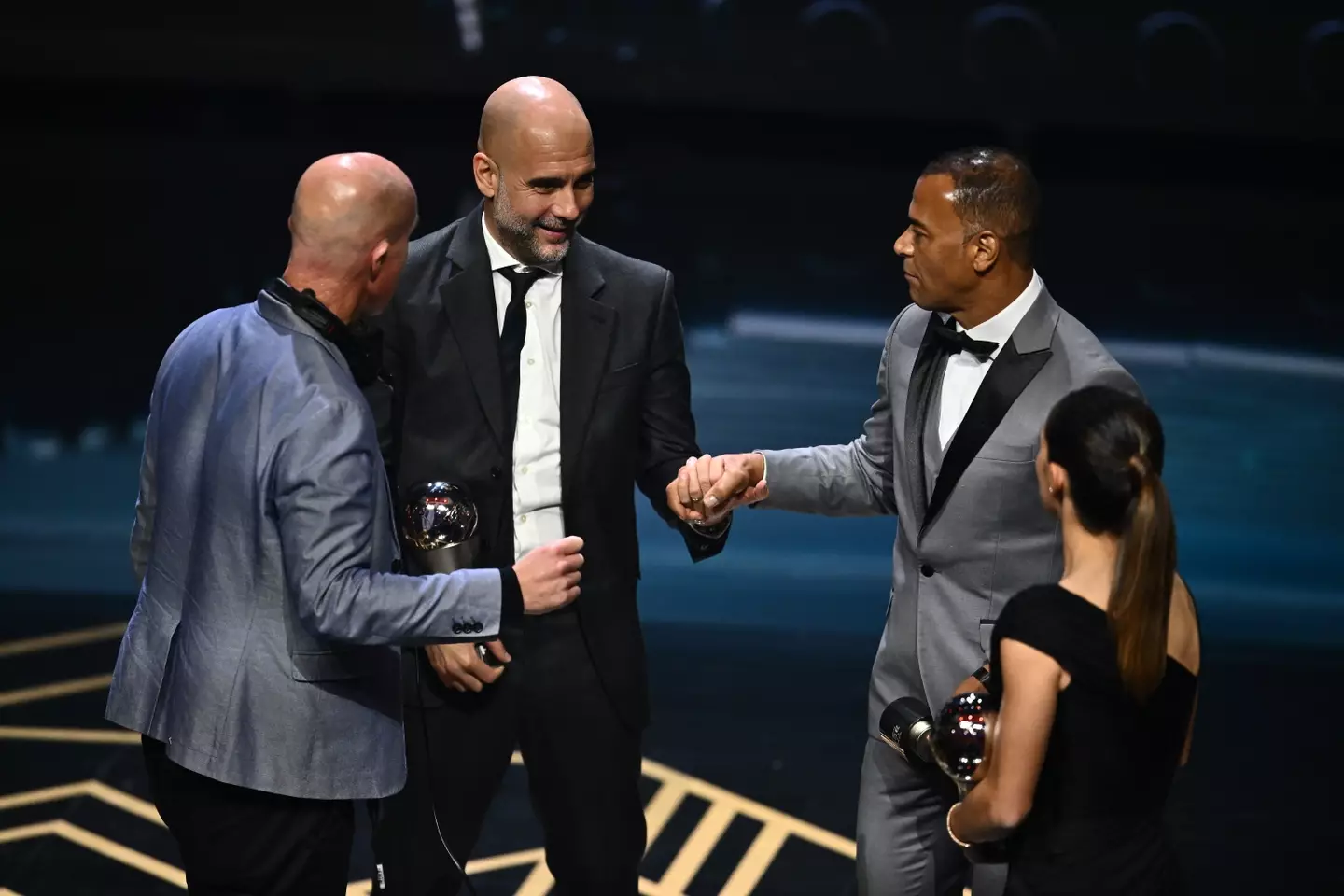 Guardiola receiving his award on Monday evening. (Image