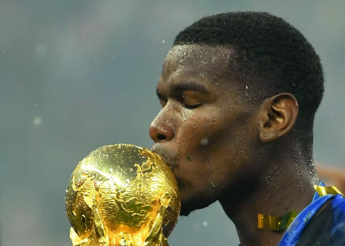 Paul Pogba kisses the World Cup trophy after scoring in France's 4-2 victory over Croatia during the 2018 World Cup final |
