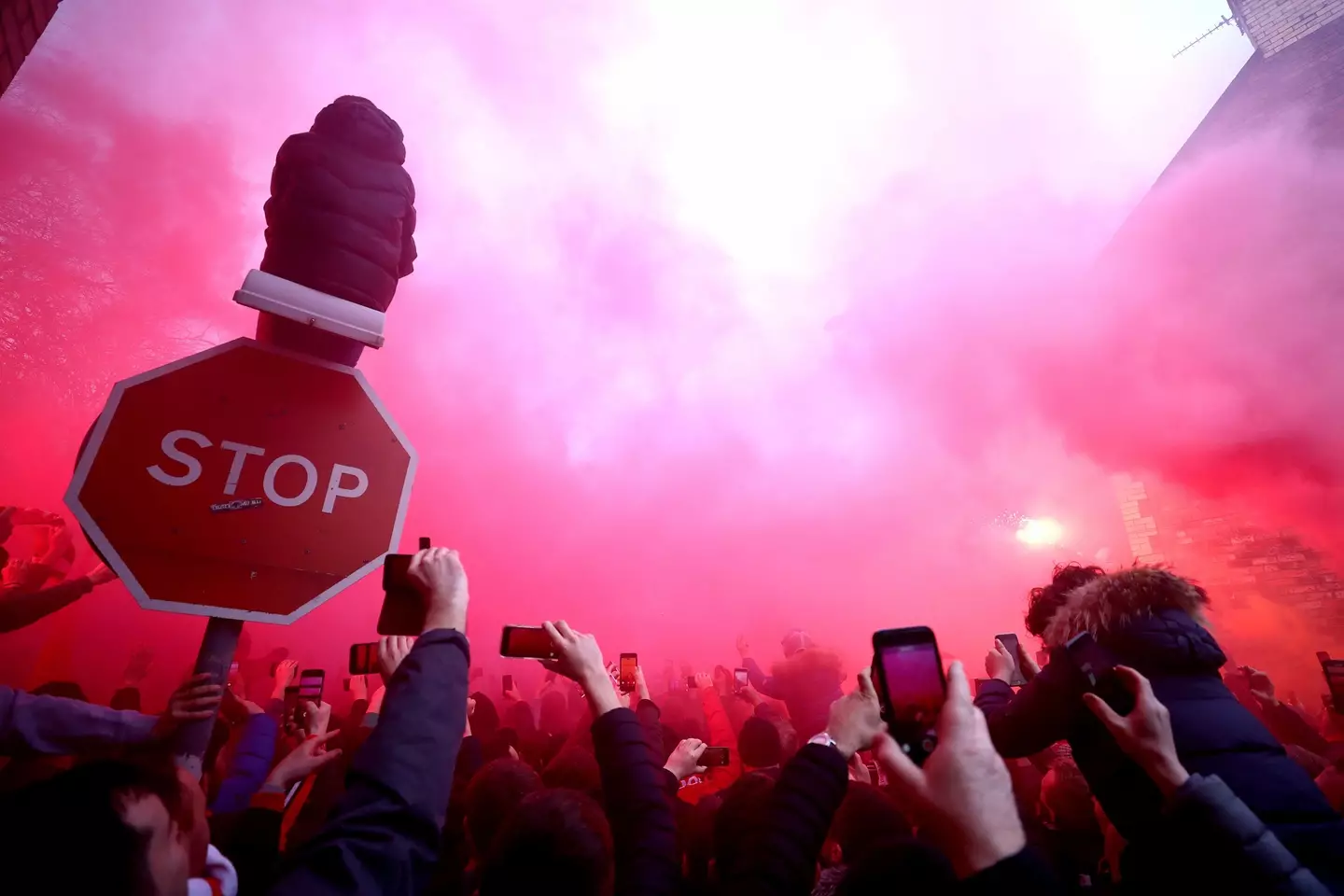 Liverpool fans set off flares as City's coach arrived for a Champions League game. Image: PA Images