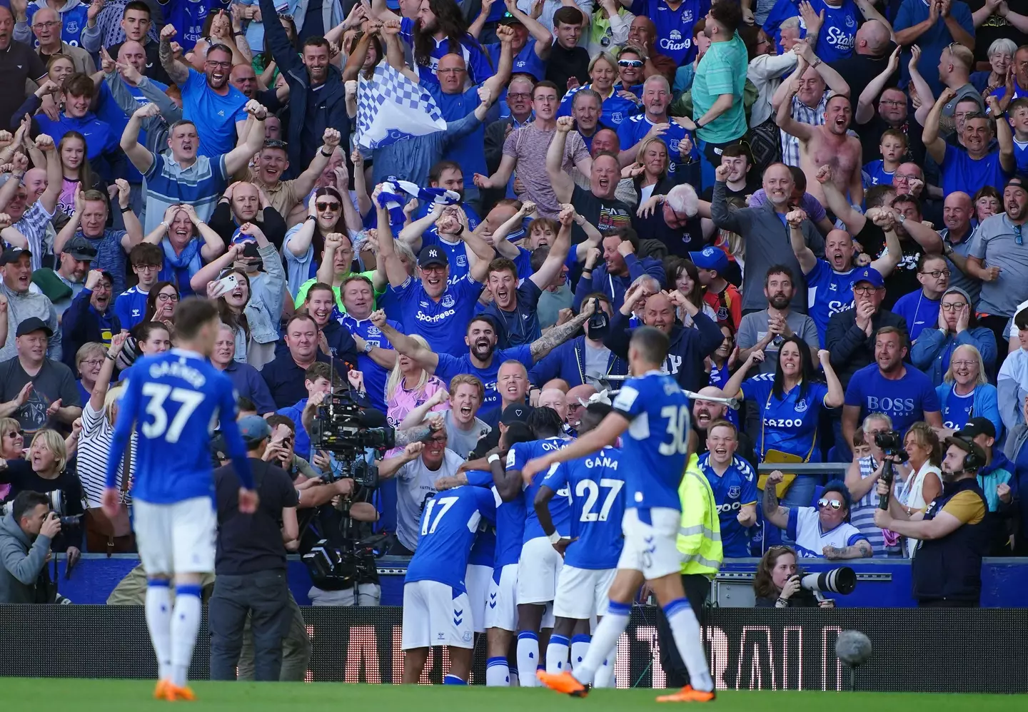 Everton fans celebrate after Doucoure's goal. Image: Alamy