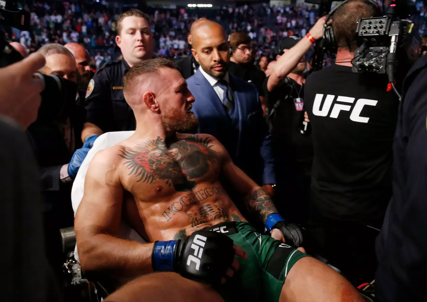 McGregor being stretchered out of his fight with Poirier in 2021. (Image