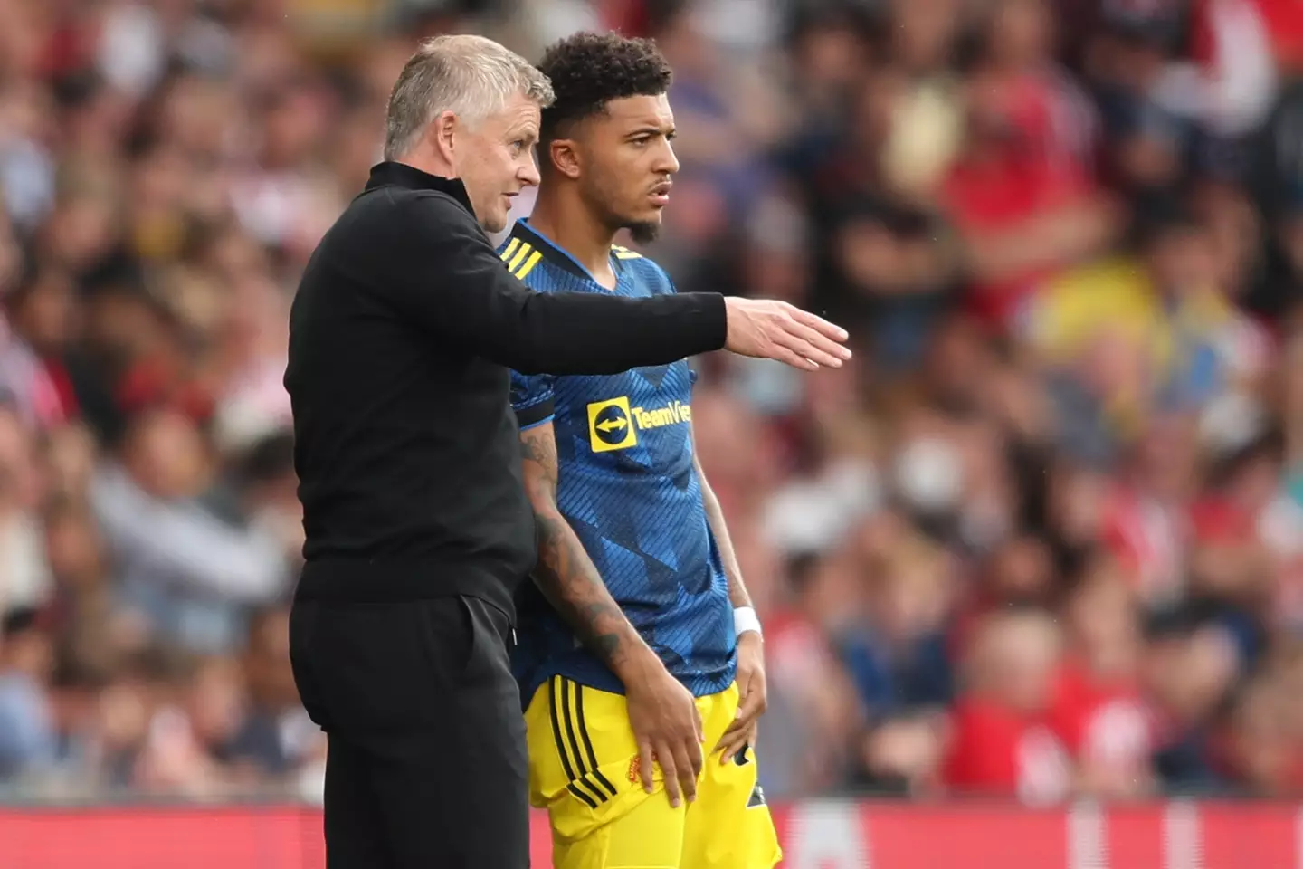 Ole Gunnar Solskjaer and Jadon Sancho during a Premier League game. Image: Getty