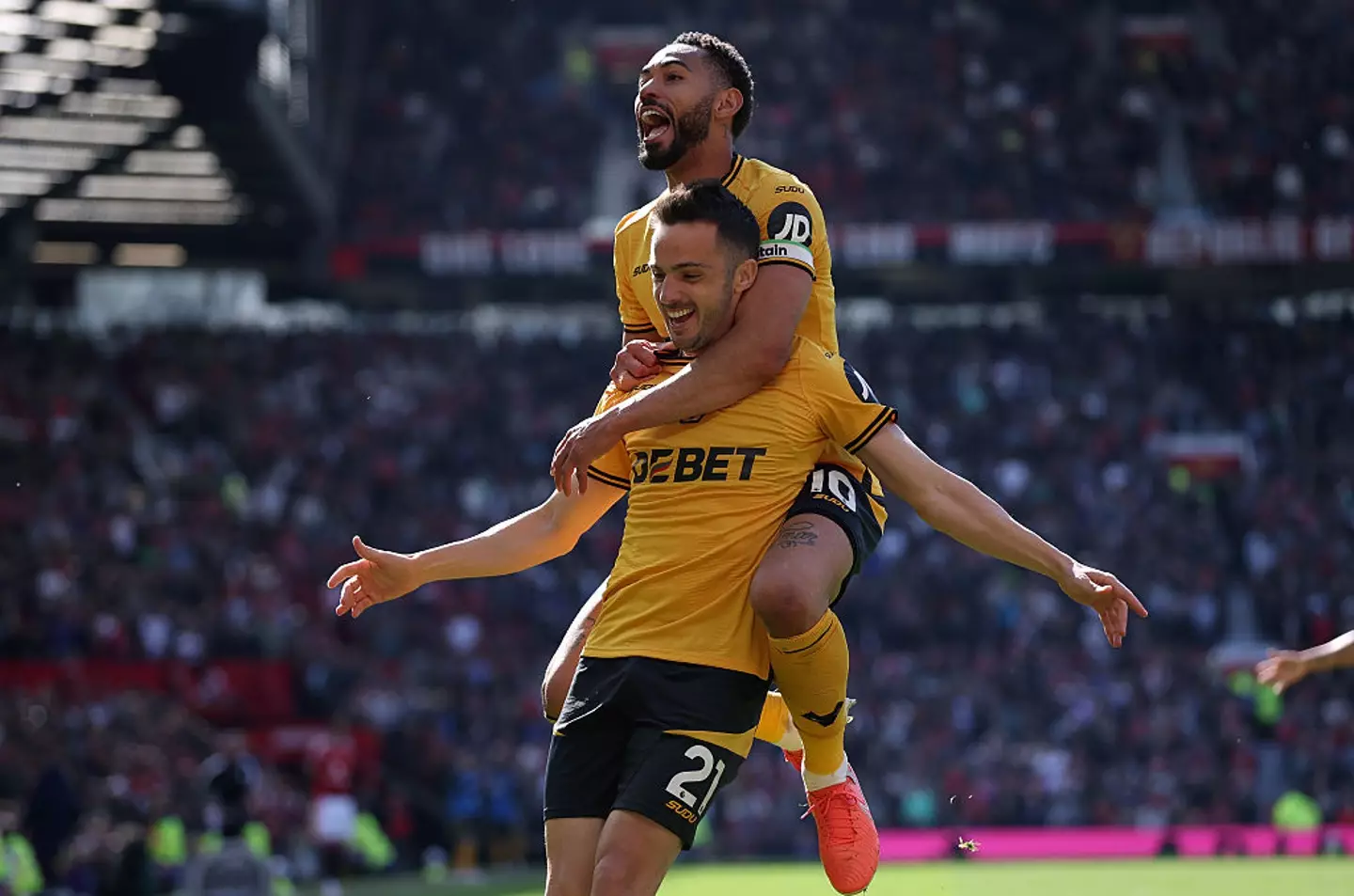 Matheus Cunha celebrated with teammate Pablo Sarabia after Wolves took the lead over Manchester United. (Image: Getty)