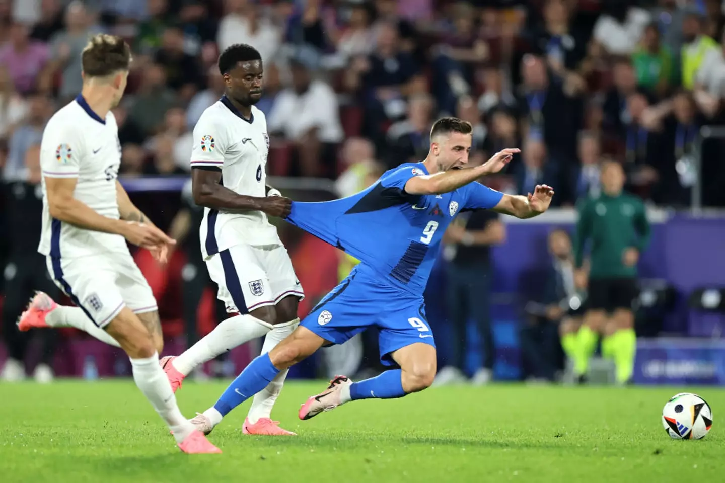 Marc Guehi was shown a yellow card for a foul on Andraz Sporar of Slovenia. (Image: Getty)