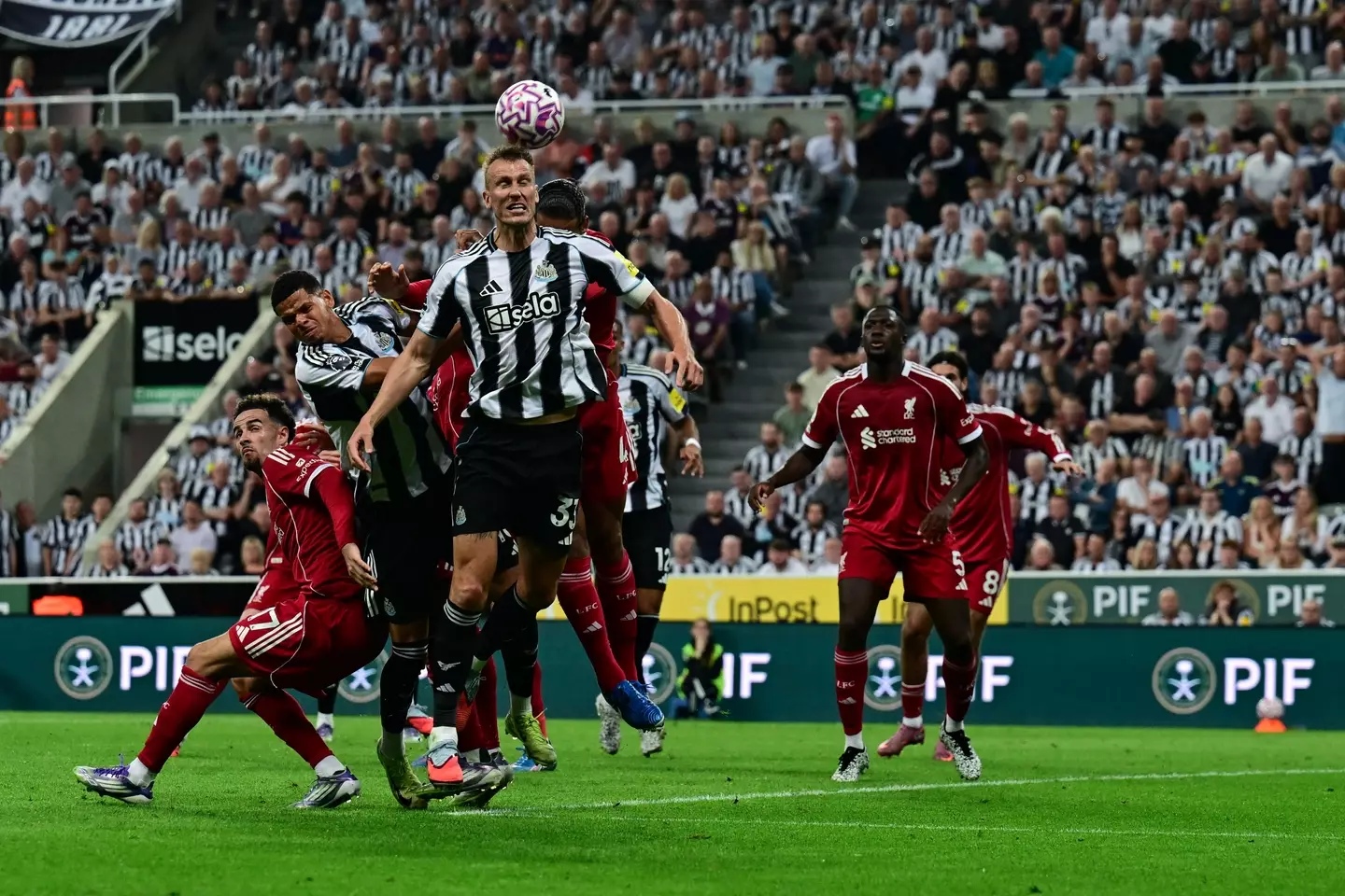 Dan Burn heads the ball during a set-piece in Newcastle United's game against Liverpool. Image: Getty