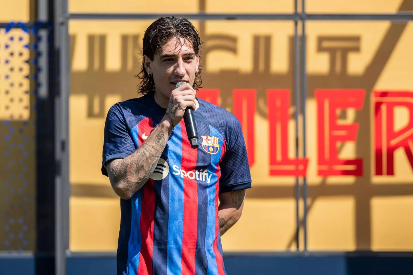 Bellerin speaks at his Barcelona unveiling. (Image