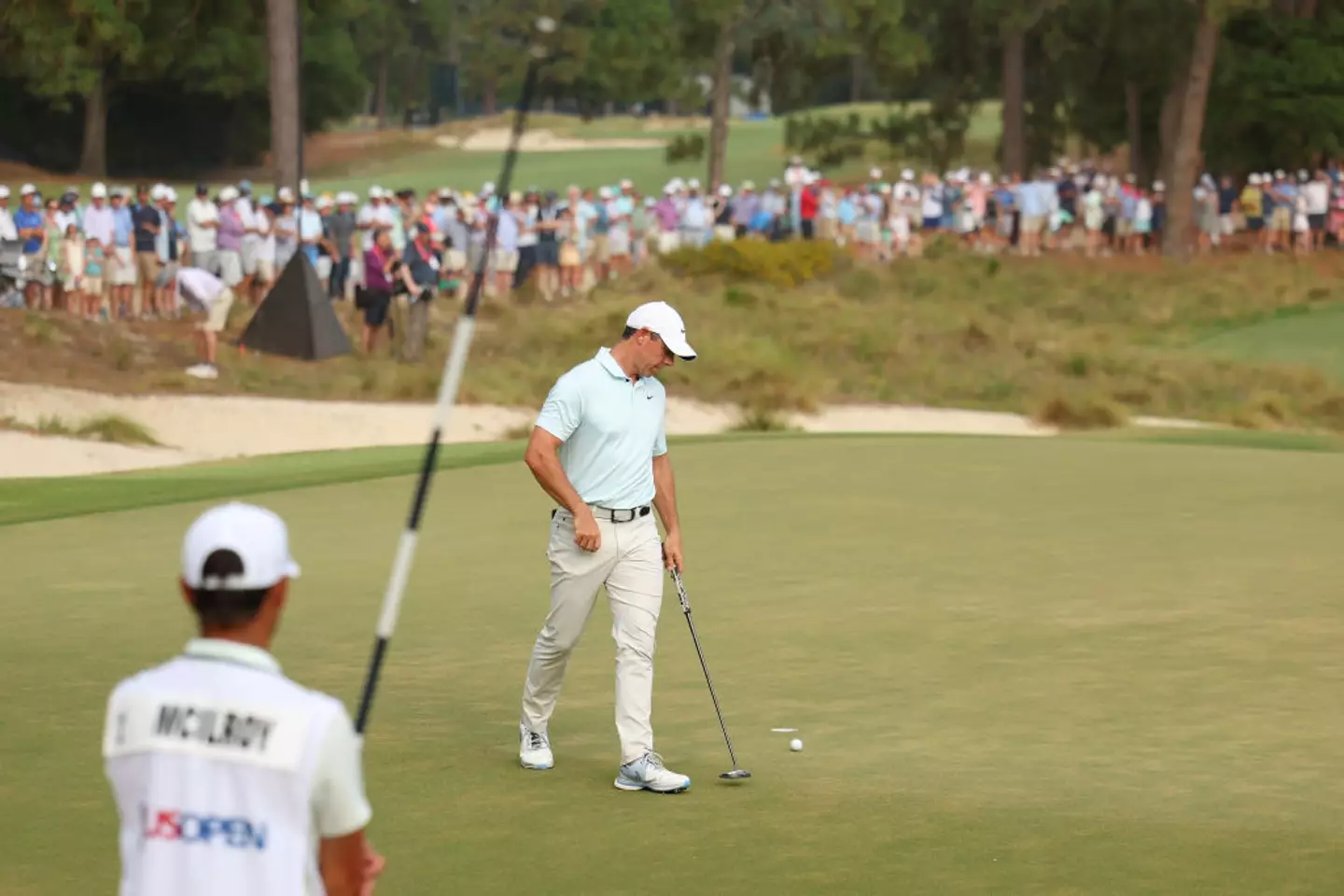 Rory McIlroy disappointed as he bogey'd hole 18, to drop to second place with a score of -5 (Image: Getty)