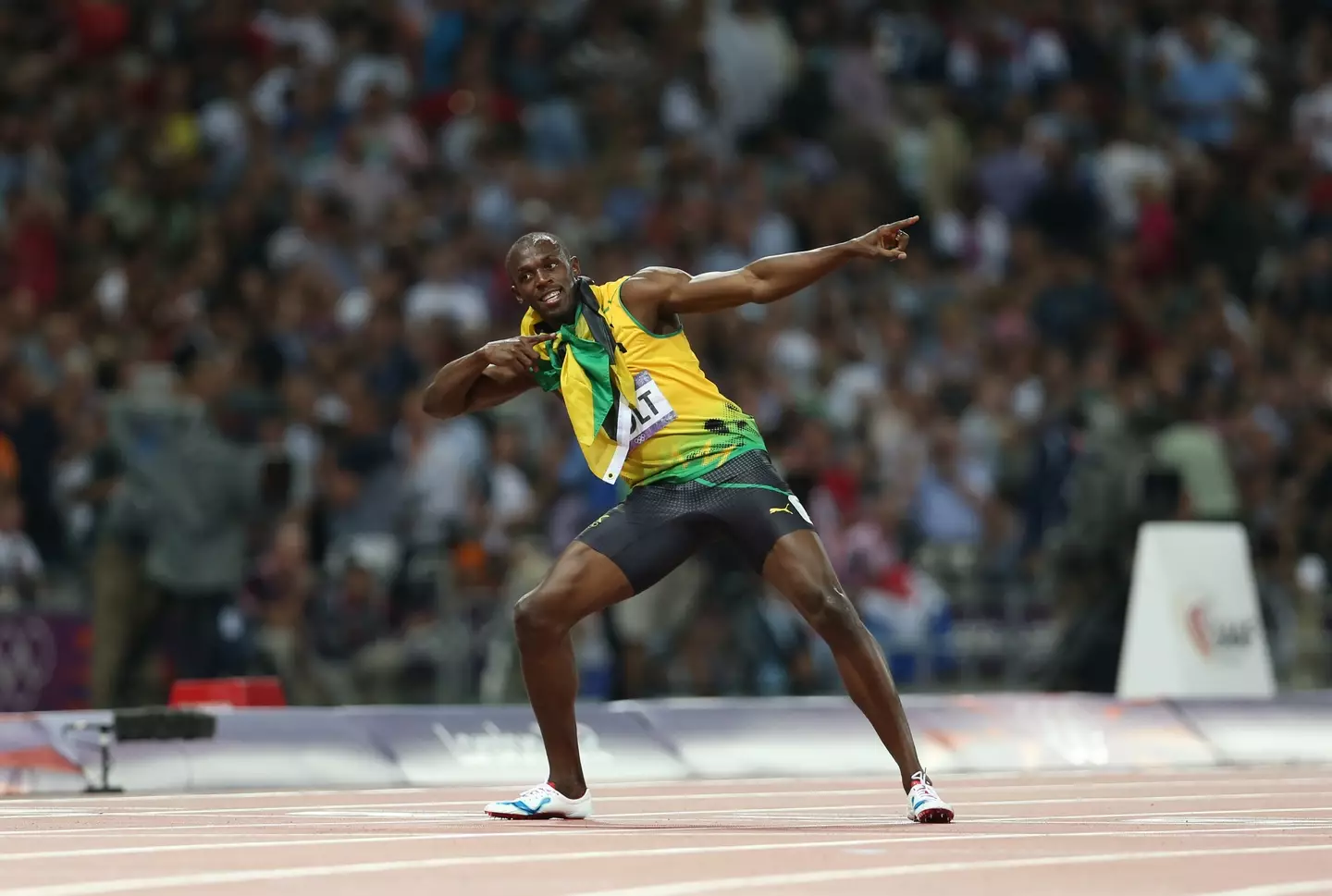 Jamaican sprinter Usain Bolt celebrates Olympic gold.