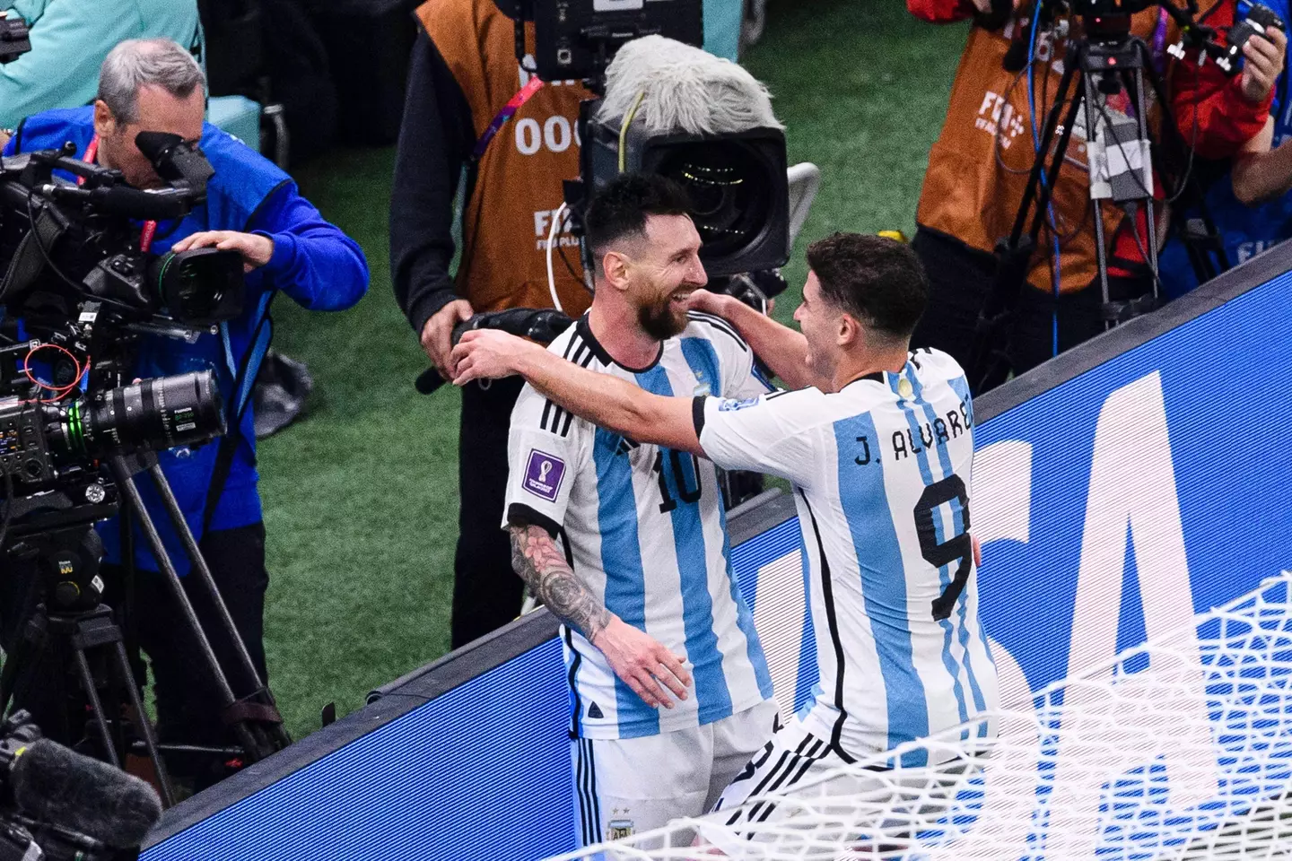 Messi and Alvarez celebrate Argentina's third goal. (Image