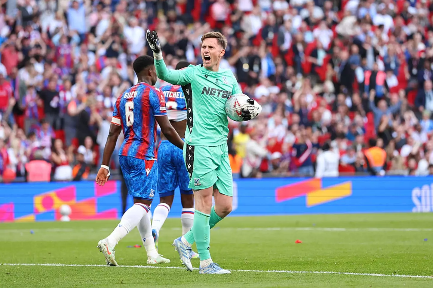 Dean Henderson saved a penalty from Omar Marmoush during the FA Cup final. (Image: Getty)