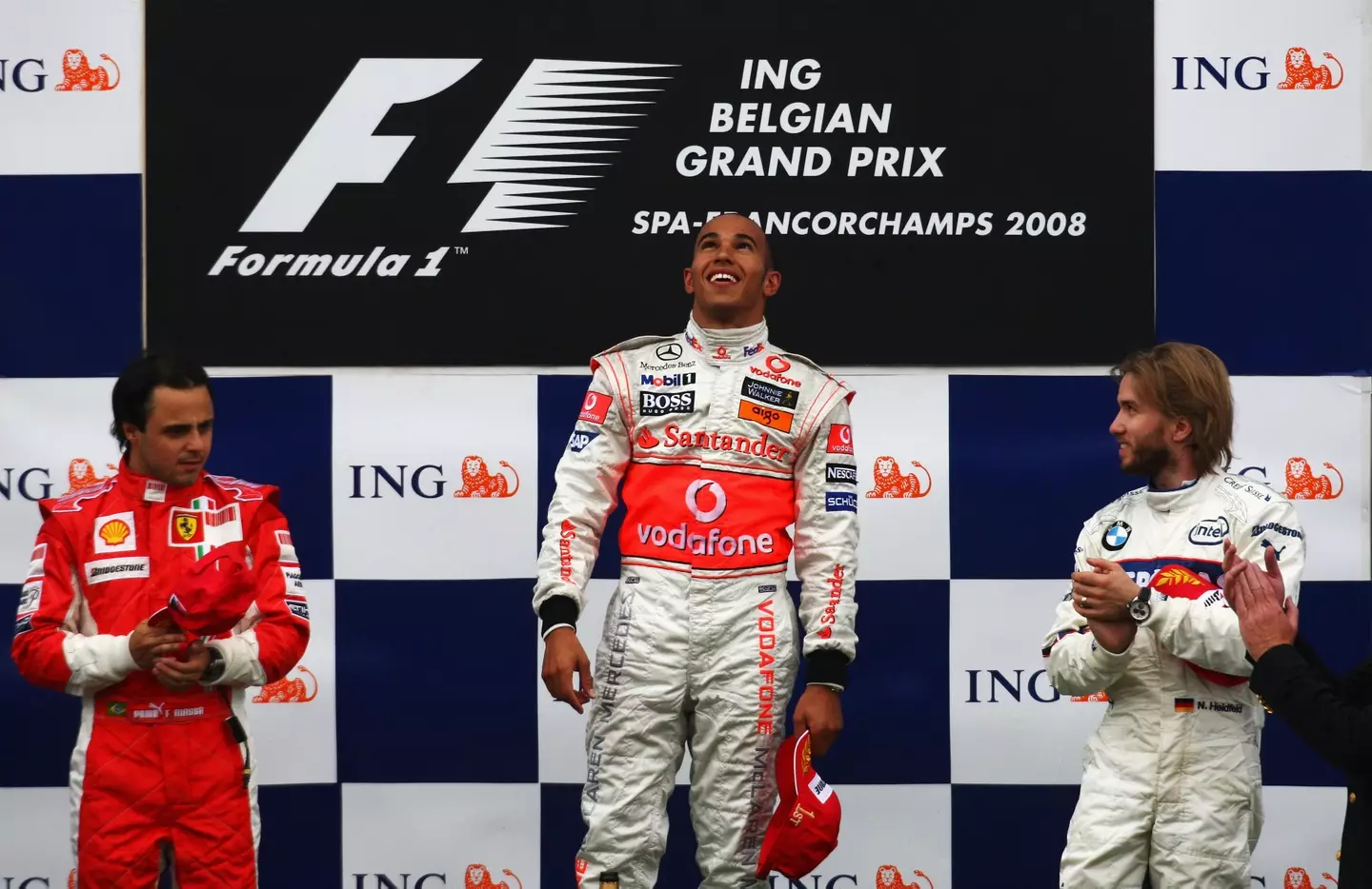 Lewis Hamilton on the 2008 Belgium Grand Prix podium with Felipe Massa (credit: getty)