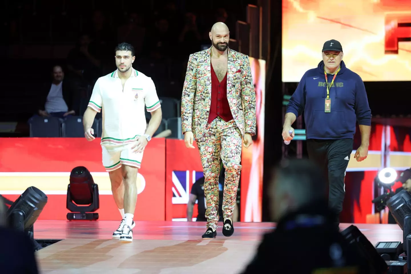 Tommy is regularly flanked by brother Tyson and father John (Credit:Getty)