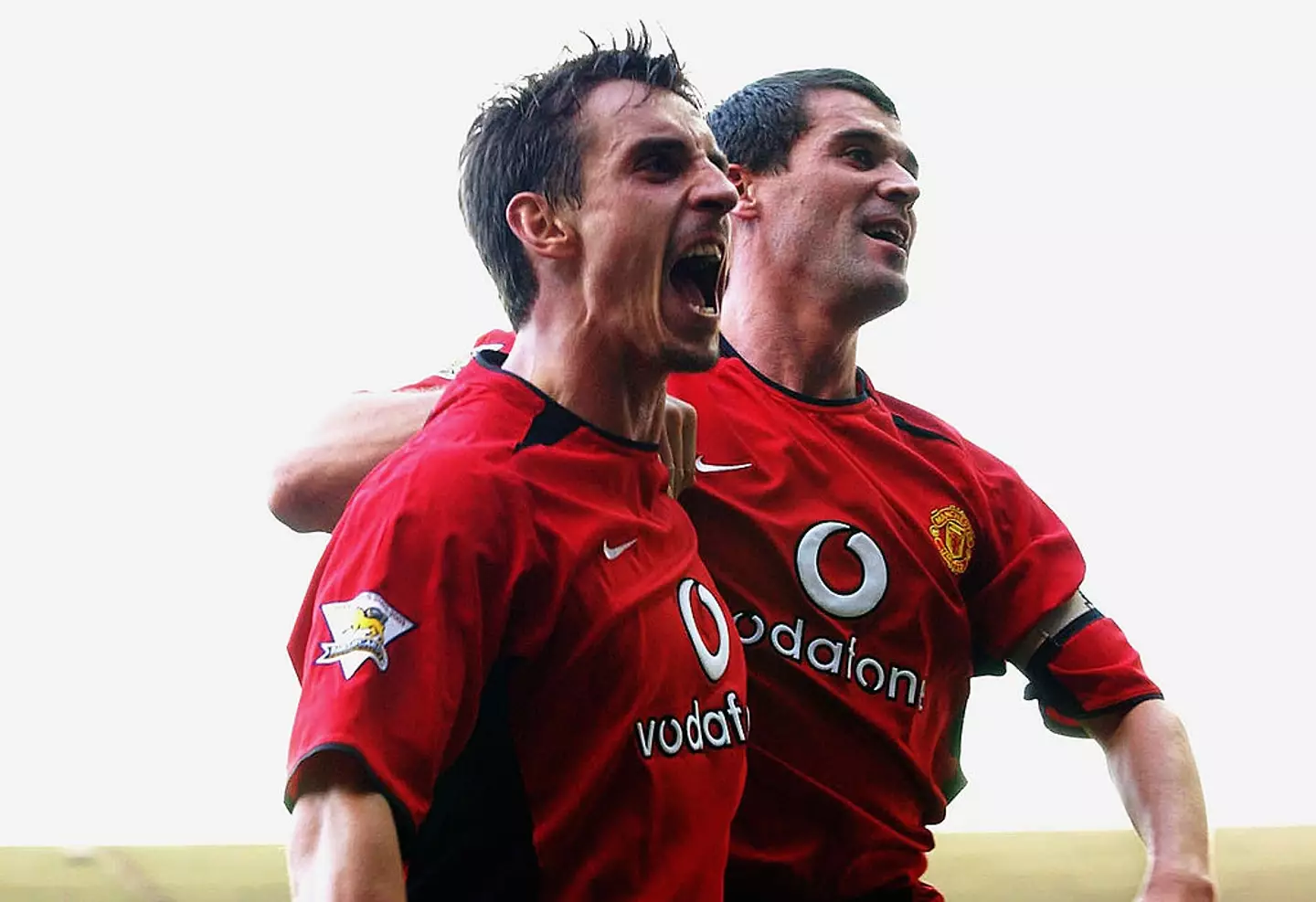 Gary Neville and Roy Keane celebrate a Manchester United goal (