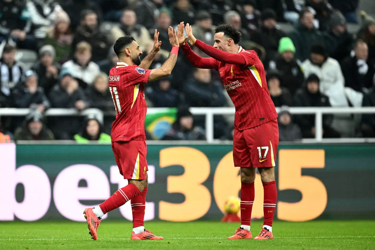 Curtis Jones celebrates with Mo Salah. Image: Getty