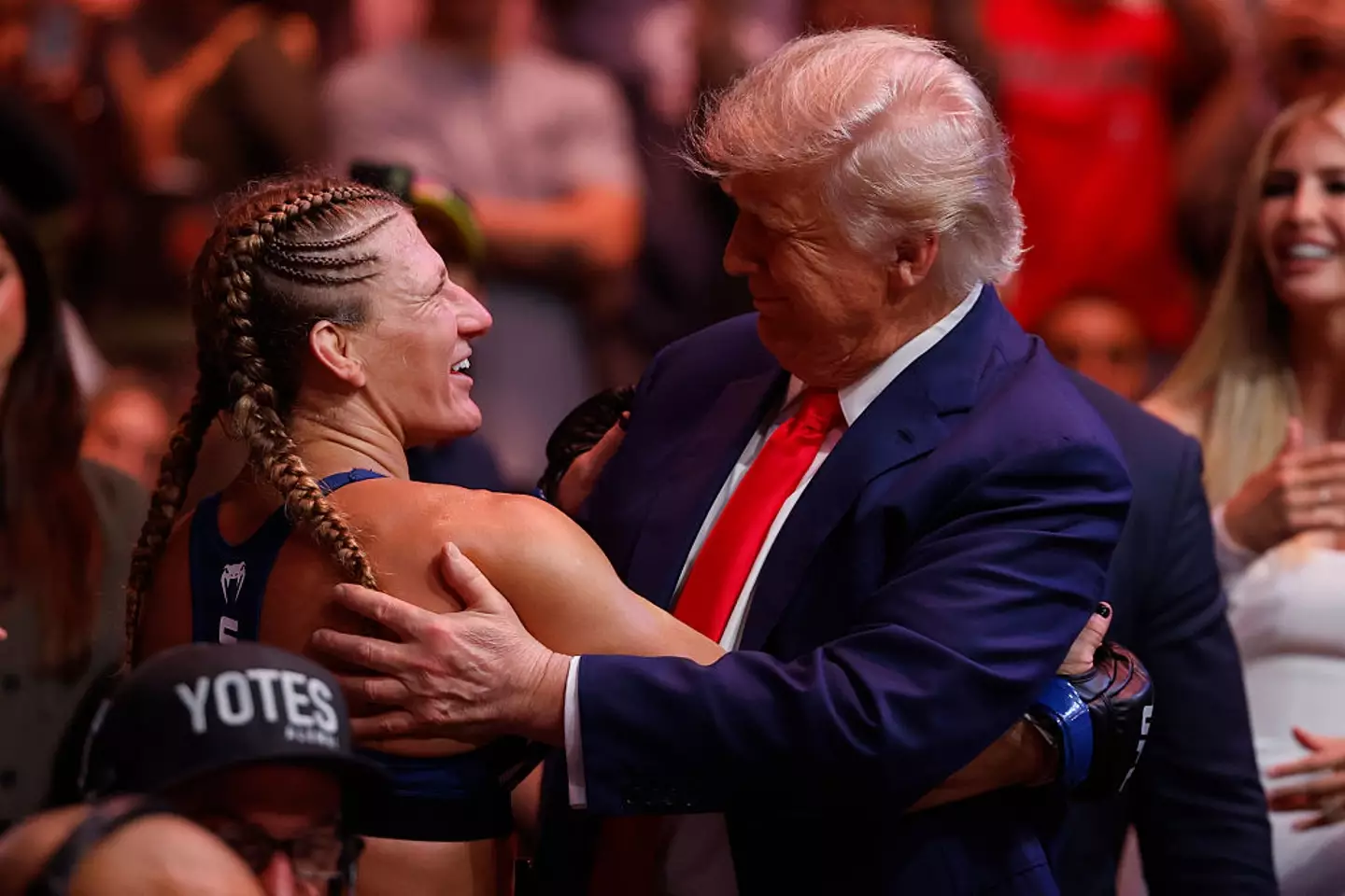 Donald Trump celebrated with Kayla Harrison following her win at UFC 316 in June. (Image: Getty)