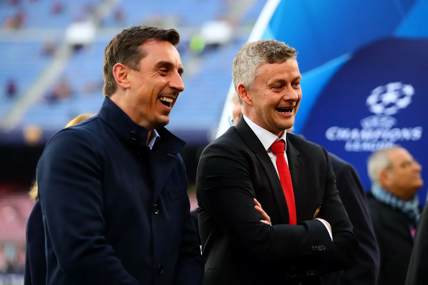 Gary Neville shares a joke with Ole Gunnar Solskjaer. Image: Getty