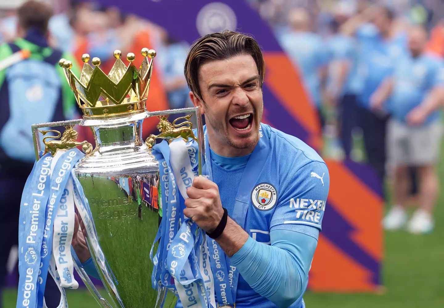 Grealish was very happy to get his hands on the Premier League trophy. Image: PA Images