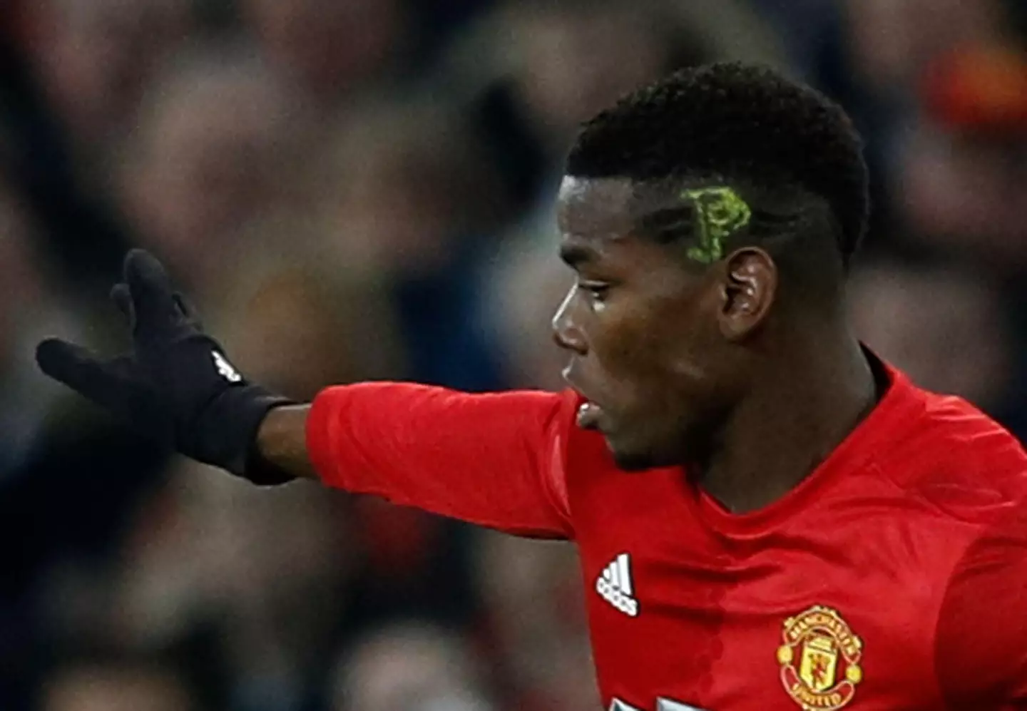 Paul Pogba plays against Liverpool with "PP" painted onto the side of his head |