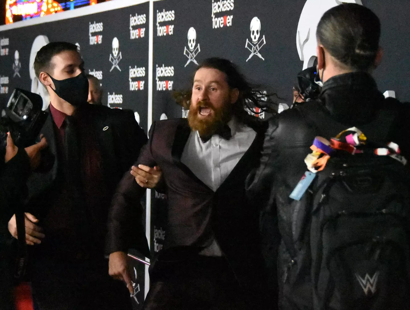 Zayn is escorted out of the premiere by security. Image: PA Images